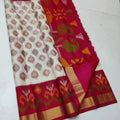 Red and white saree with floral patterns on a white background
